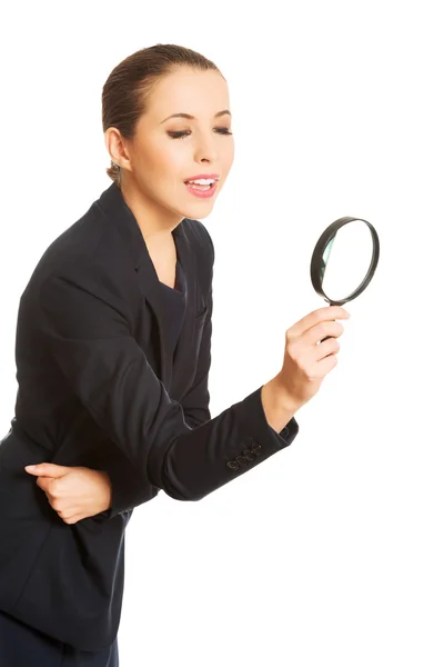 Businesswoman with magnifying glass. — Stock Photo, Image