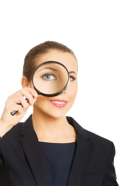 Businesswoman with magnifying glass. — Stock Photo, Image