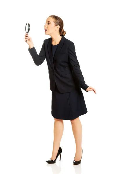 Businesswoman with magnifying glass. — Stock Photo, Image