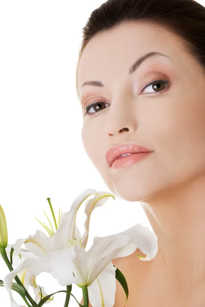 Woman with lily flower Stock Image