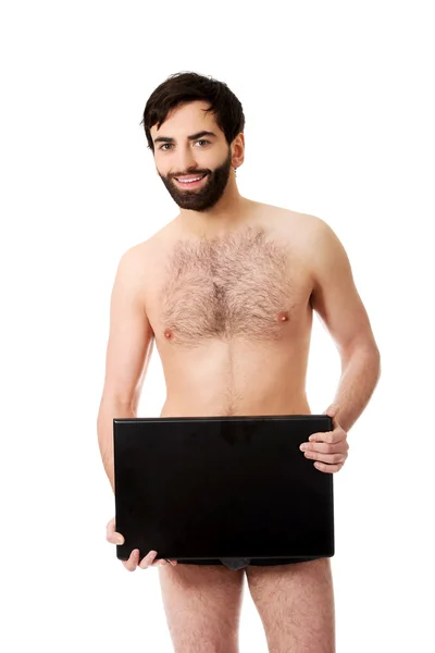 Shirtless man bedrijf laptop. — Stockfoto