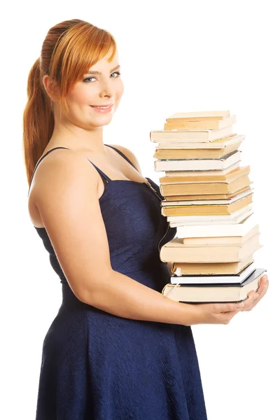 Mujer con sobrepeso sosteniendo libros —  Fotos de Stock