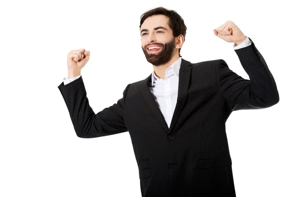 Businessman making fists in a winner gesture. — Stock Photo, Image