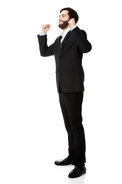 Businessman making fists in a winner gesture. — Stock Photo, Image