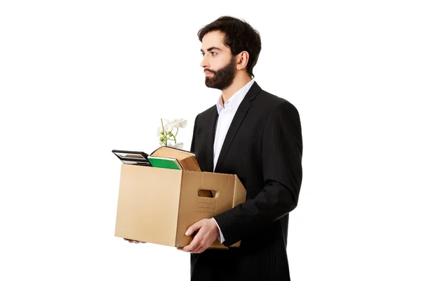 Businessman holding box with personal belongings. — Stock Photo, Image