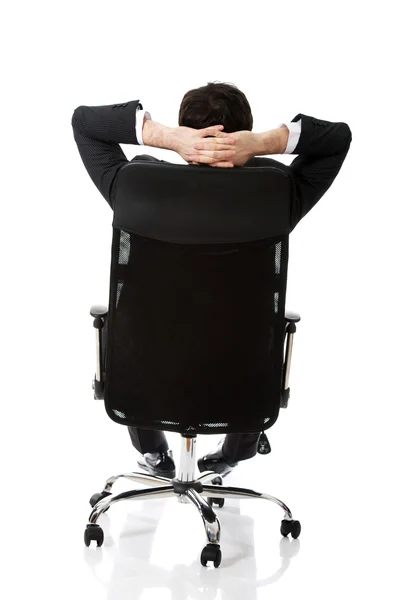 Young businessman sesting on a chair. — Stock Photo, Image