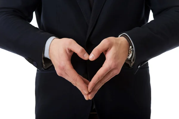 El hombre está mostrando una señal de amor por sus manos . — Foto de Stock