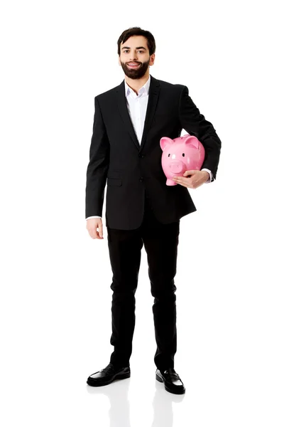 Επιχειρηματίας που κατέχει μια τράπεζα Piggy. — Φωτογραφία Αρχείου