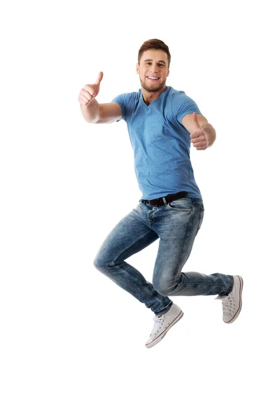 Handsome man jumping for joy. — Stock Photo, Image