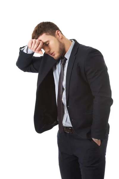 Worried businessman touching his forehead. — Stock Photo, Image