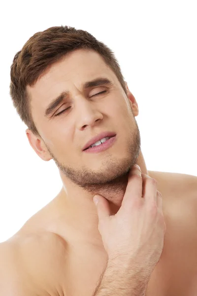 Athletic man feeling pain in his neck. — Stock Photo, Image