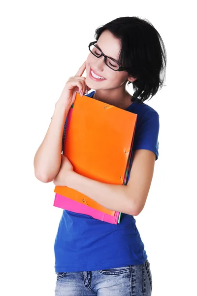 Junge glückliche Studentin hält ihre Notizen — Stockfoto