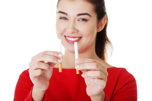 Young woman with broken cigarette — Stock Photo, Image