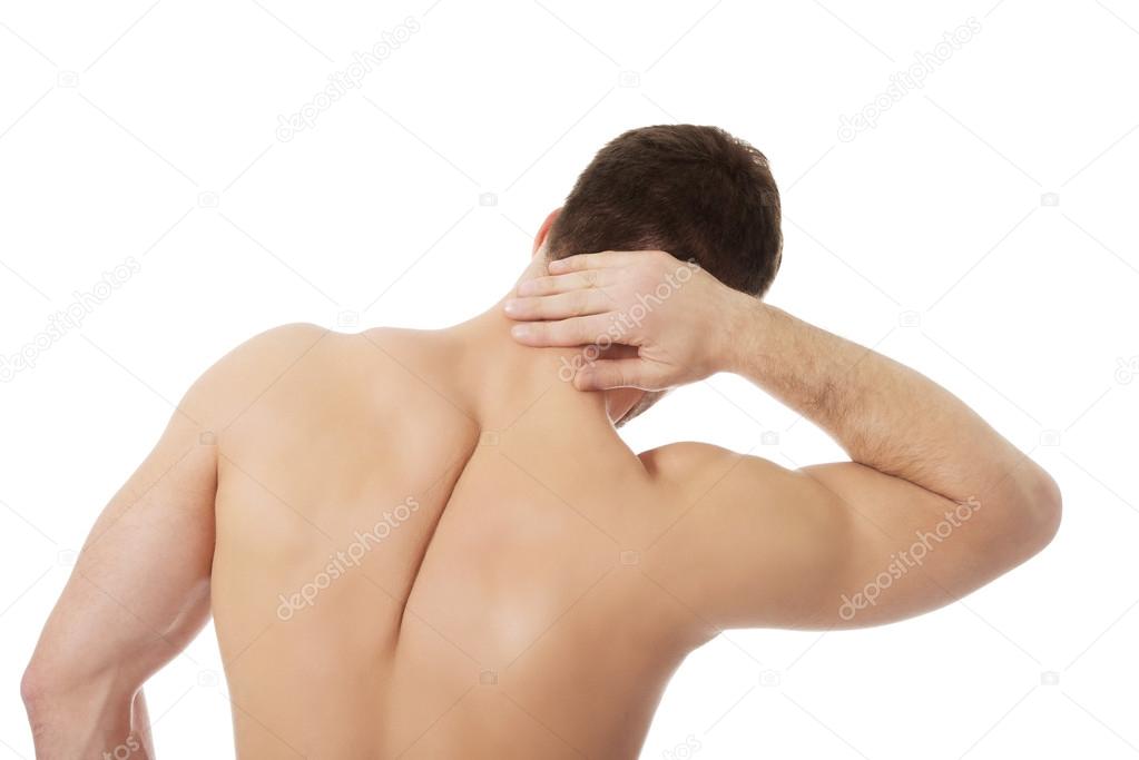 Athletic man feeling pain in his neck.