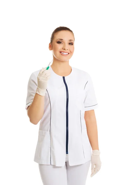 Female dentist holding a syringe — Stock Photo, Image