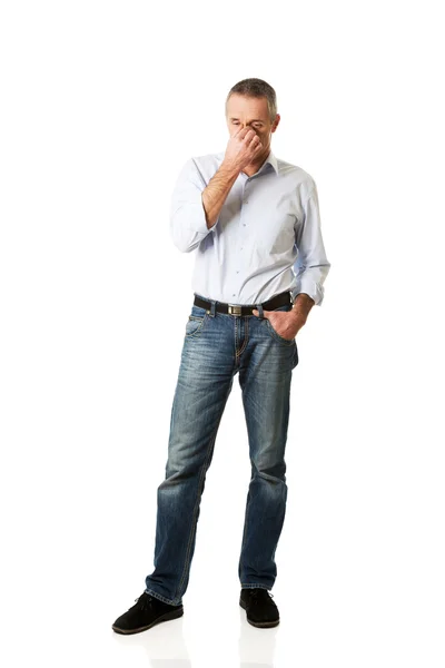 Man holding his nose because of sinus pain — Stock Photo, Image