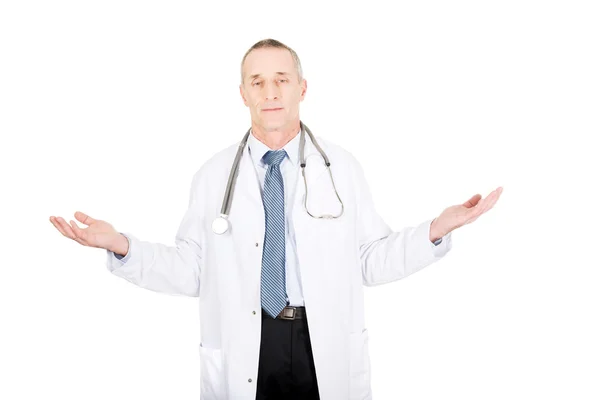 Mature male doctor holding copyspace — Stock Photo, Image