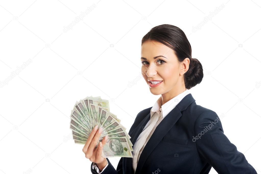 Businesswoman holding a polish money