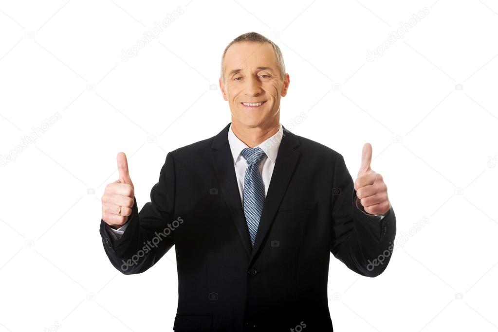 Mature businessman gesturing ok sign