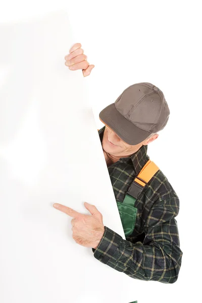 Gardener in uniform showing empty banner — Stock Photo, Image