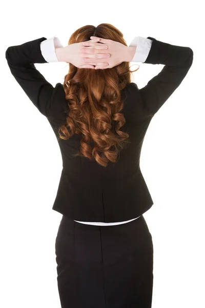 Young businesswoman with hands behind head. — Stock Photo, Image