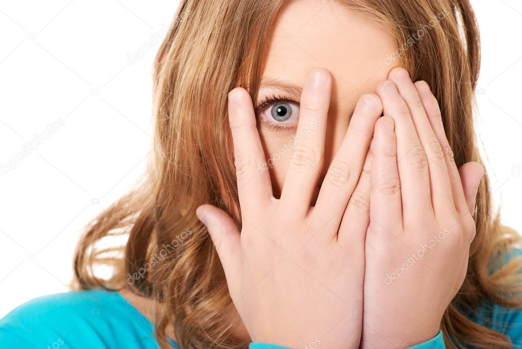 Woman covering her face with hands