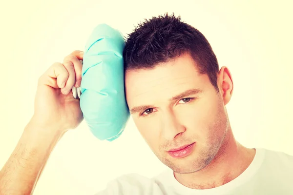 Man with ice bag for headaches — Stock Photo, Image