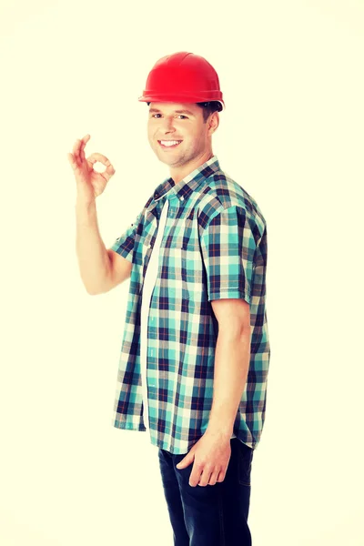 Constructor en el gesto del casco signo OK — Foto de Stock