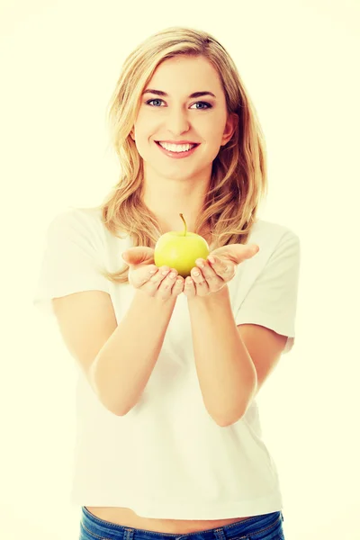 Woman with a green apple — Stock Photo, Image