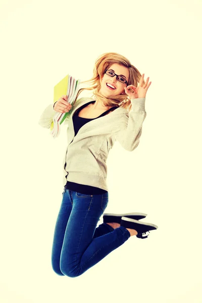 Young casual woman, student jumping. — Stock Photo, Image