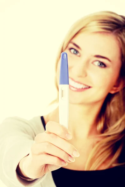 Happy woman with pregnancy test — Stock Photo, Image