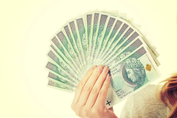 Woman's hand holding polish money — Stock Photo, Image