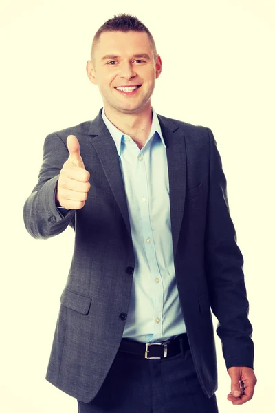 Businessman gesturing thumb up sign — Stock Photo, Image