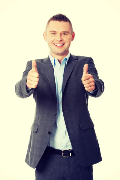 Businessman gesturing thumbs up sign — Stock Photo, Image