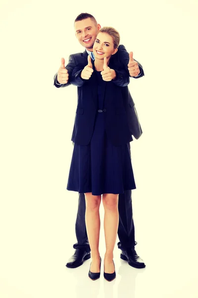Casal de negócios mostrando polegares para cima sinal — Fotografia de Stock