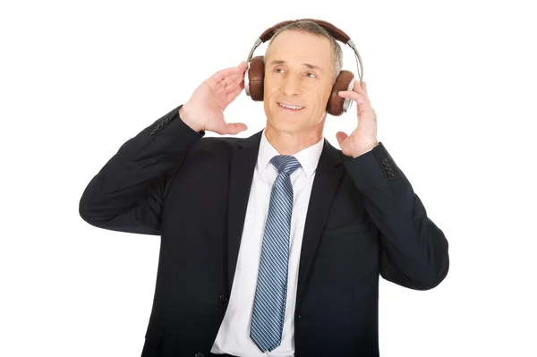 Businessman with big headphones — Stock Photo, Image