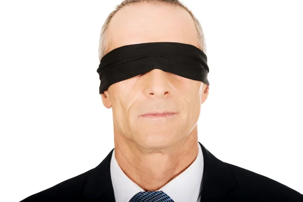 Businessman with band on eyes — Stock Photo, Image