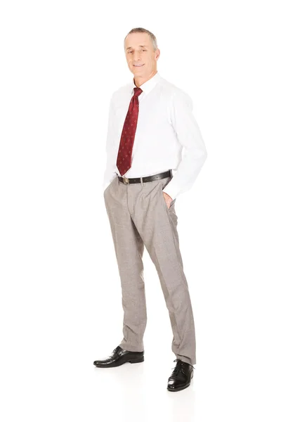 Businessman with hands in pockets — Stock Photo, Image