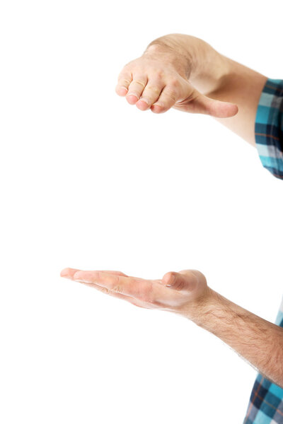 Man's hands holding something invisible