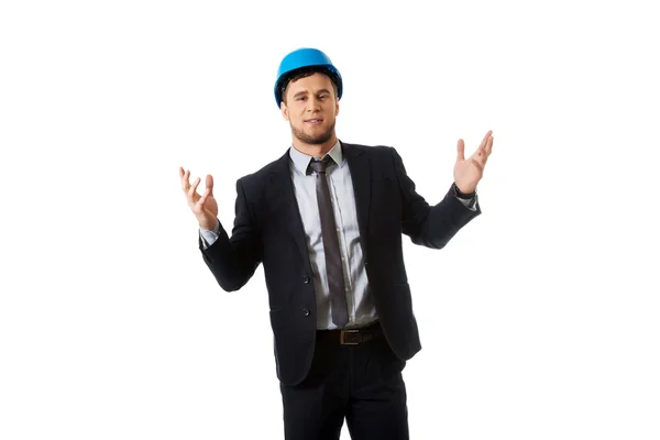 Businessman in hard hat holding copyspace. — Stock Photo, Image