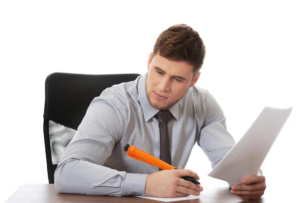 Young business man writing a note. — Stock Photo, Image