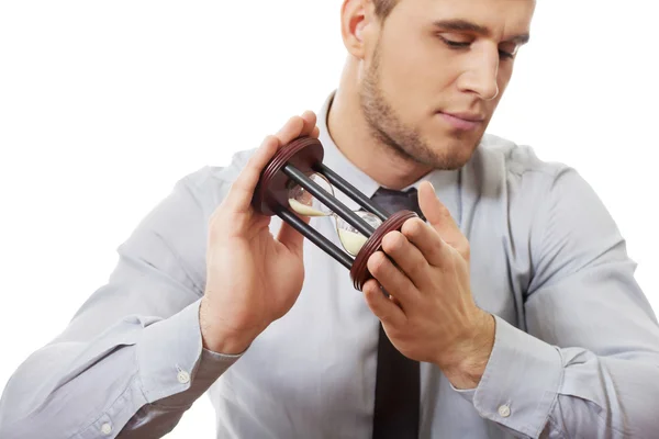 Hombre de negocios sosteniendo reloj de arena . —  Fotos de Stock