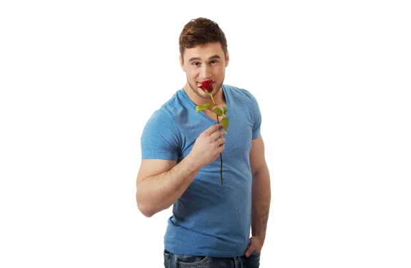 Handsome man with red rose. — Stock Photo, Image