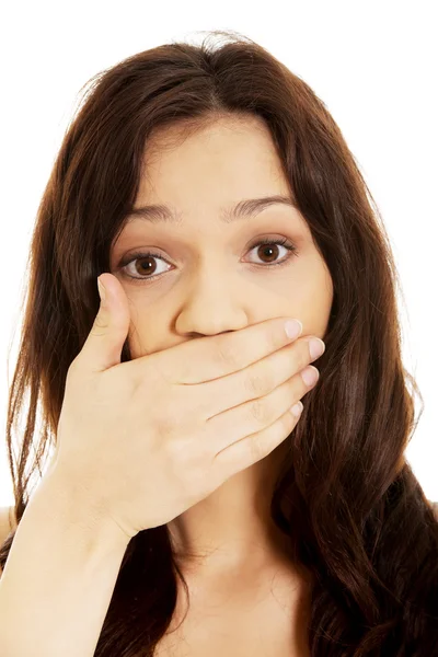 Surprised woman covering her mouth. Stock Photo