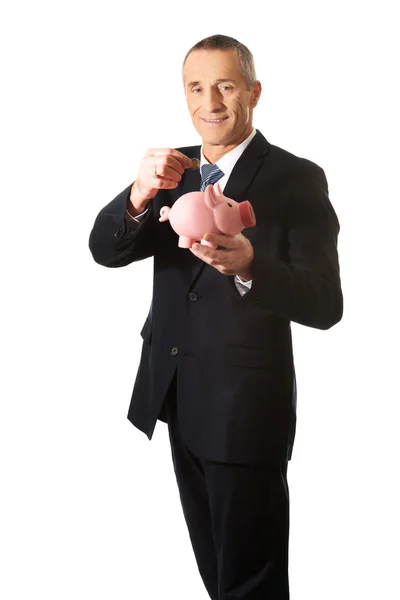 Empresario Holding Piggybank —  Fotos de Stock