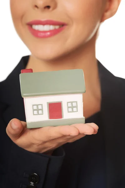 Businesswoman holding house model — Stock Photo, Image