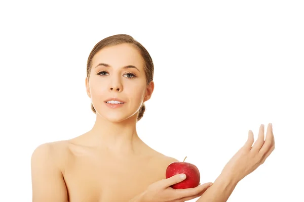 Nahá žena drží jablko — Stock fotografie