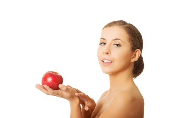 Nude woman holding an apple — Stock Photo, Image