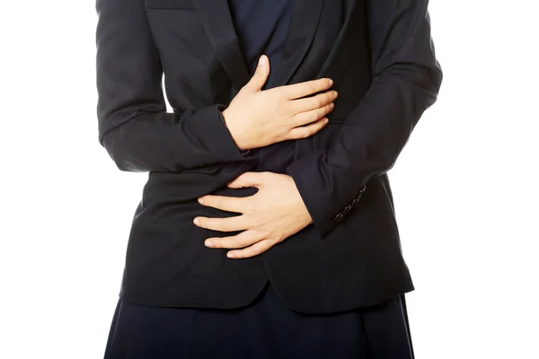 Businesswoman with stomach ache — Stock Photo, Image