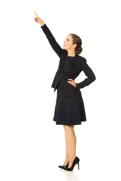 Businesswoman pointing up — Stock Photo, Image